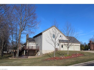 The back of the home offers a patio and deck - gre