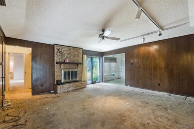 Spacious living room with wood burning fireplace a
