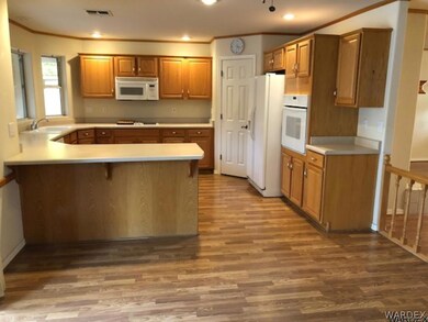 View of kitchen from dining