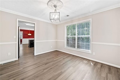 Unfurnished dining area with baseboards, a notable