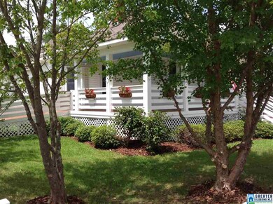 The landscaping , nice trees & covered porch make 