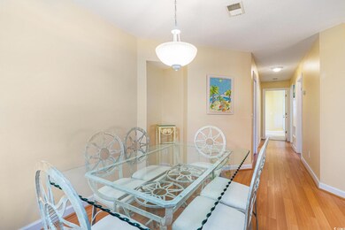 Dining space featuring baseboards and light wood-style floors