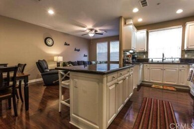View of kitchen looking towards family room and di
