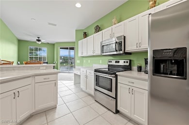 Kitchen with stainless steel appliances, light til