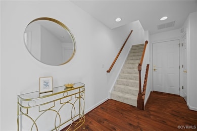 Staircase to the second floor and laminate wood fl