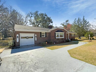 Single story home featuring an attached garage, a 