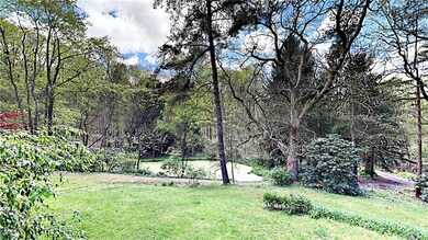 Yard overlooks pond.