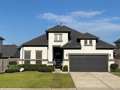 Home has a Charming White with washed stone and grey accents front view..