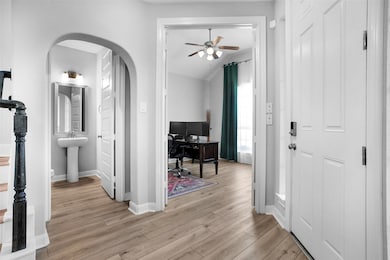 Home office and half bath to the right off the entry hall