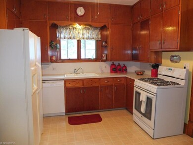 Open eat-in kitchen comes applianced with dishwash