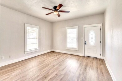 Foyer with ceiling fan, a healthy amount of sunlig