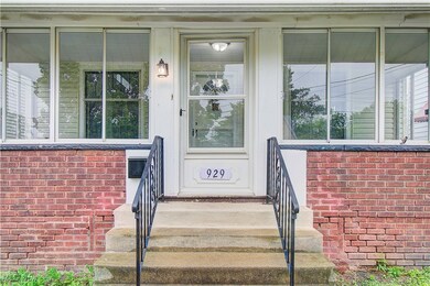 View of exterior entry with brick siding