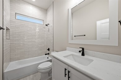 Bathroom featuring shower / washtub combination and vanity