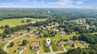 Aerial view of residential area with a heavily wooded area