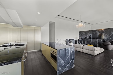 Kitchen featuring cream cabinetry, modern cabinets