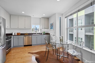 The kitchen features stainless steel appliances, large windows, mini-blinds, recessed lighting, granite countertops, ample cabinetry and a laundry closet with stacked washer/dryer.