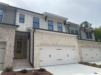 Notice all of the brick, 2-car garage and nice fla