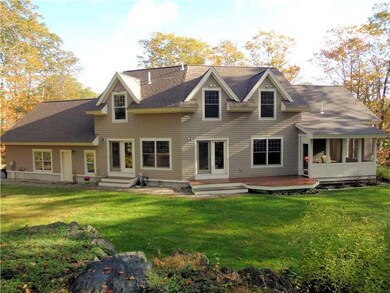 Exterior Back. Deck, and screened in...
