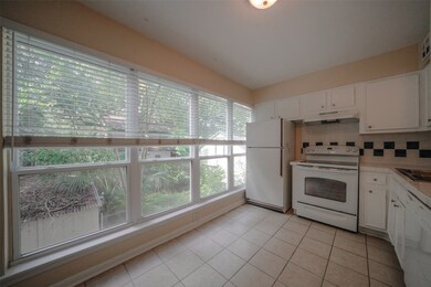 Kitchen Includes white appliances, tiled floor and