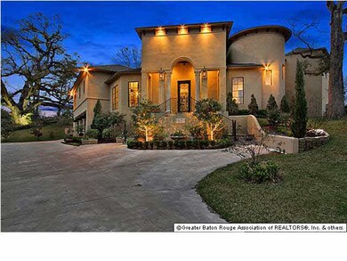 Home illuminated view from street at dusk exposes 
