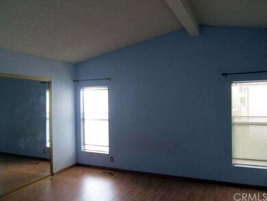 Master bedroom has vaulted ceiling and wall to wal