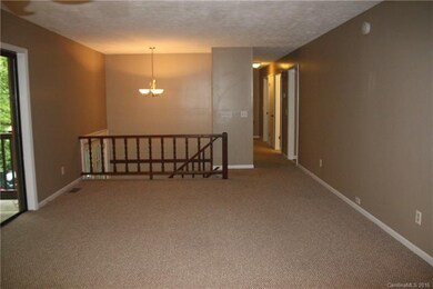Living Room with newer carpet and updated light fi