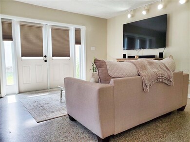 NEW French doors open to the side yard!