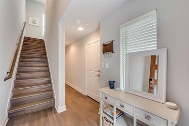 Open foyer with under stair storage.