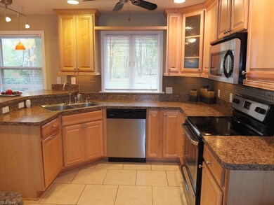 Remodeled kitchen with tile floor and stainless st