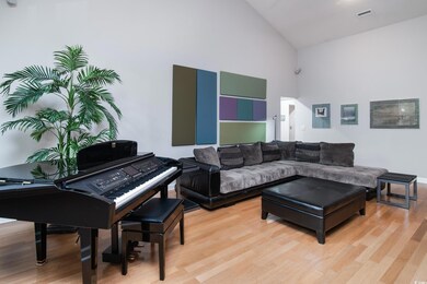 Living room with high vaulted ceiling