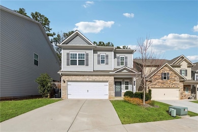 View of front of house featuring concrete driveway