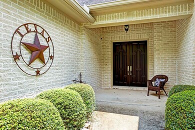 Entry features double Mahogany doors.