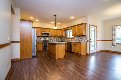This spacipus kitchen has a breakfast nook and fir