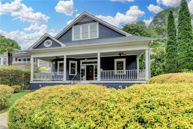 View of front of house featuring covered porch and ceiling fan