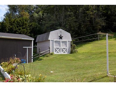 Exterior Back. ADDITIONAL SHED FOR LAWN EQUIPMENT!