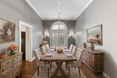 Dining area with dark wood-type flooring and ornam