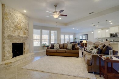 Open living concept with full stone fireplace