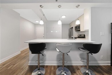 Kitchen with stainless steel appliances, light cou