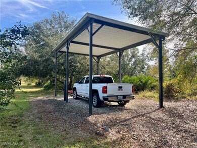 RV/Boat parking featuring a covered carport 12 foo