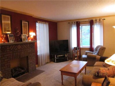 Living Room. Newer carpeting and brick gas firepla