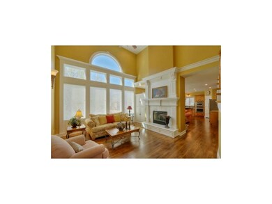 Soaring ceiling and sun drenched great room over l