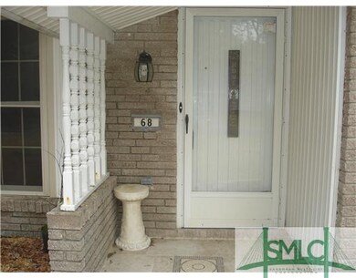 Exterior Front. New tile work entry.  Porch will k