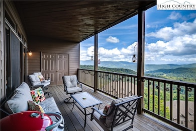 Expansive covered deck and walls of sliding glass