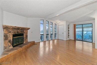 The Living room has a gas fireplace, tall vertical