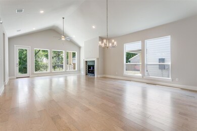 Unfurnished living room featuring ceiling fan with