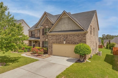 Craftsman-style home with concrete driveway, a fro