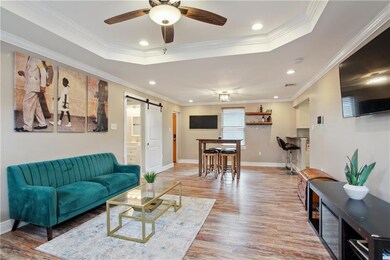 VIEW OF DEN TO BREAKFAST AREA