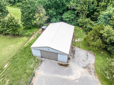 Aerial View of Barn/Shop At one end are stalls for livestock and large front area  area for workshop and storage