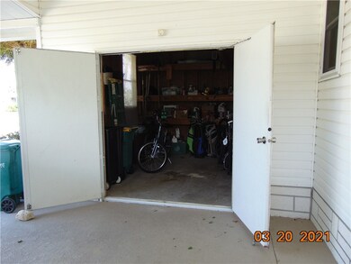 Double door entry to storage shed. Golf cart fits