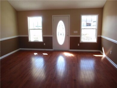 Spacious living room with prefinished hardwood